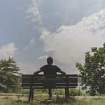 a man sitting on a bench
