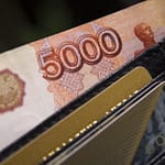 a close-up of a wallet with money
