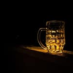 A glass for beer on a table. How Much Beer Are Canadians Drinking 2025