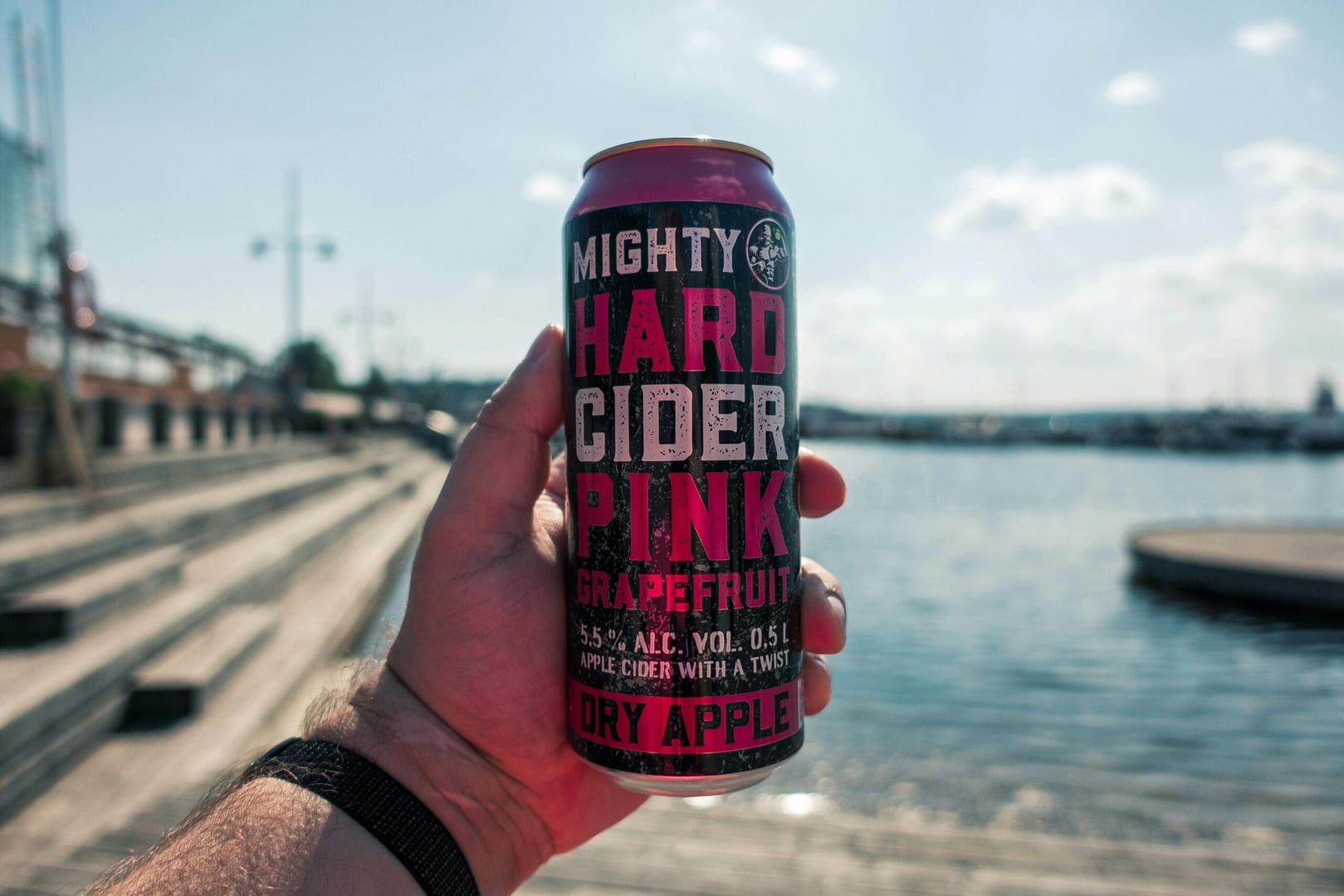 Man hand holding cider can. How much Ciders are Canadians drinking?